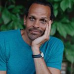 A bust photo of Ross Gay.
